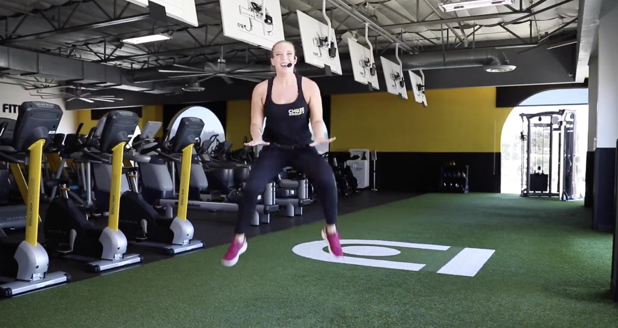 Coach Mariah showing a power jump on iChuze Fitness